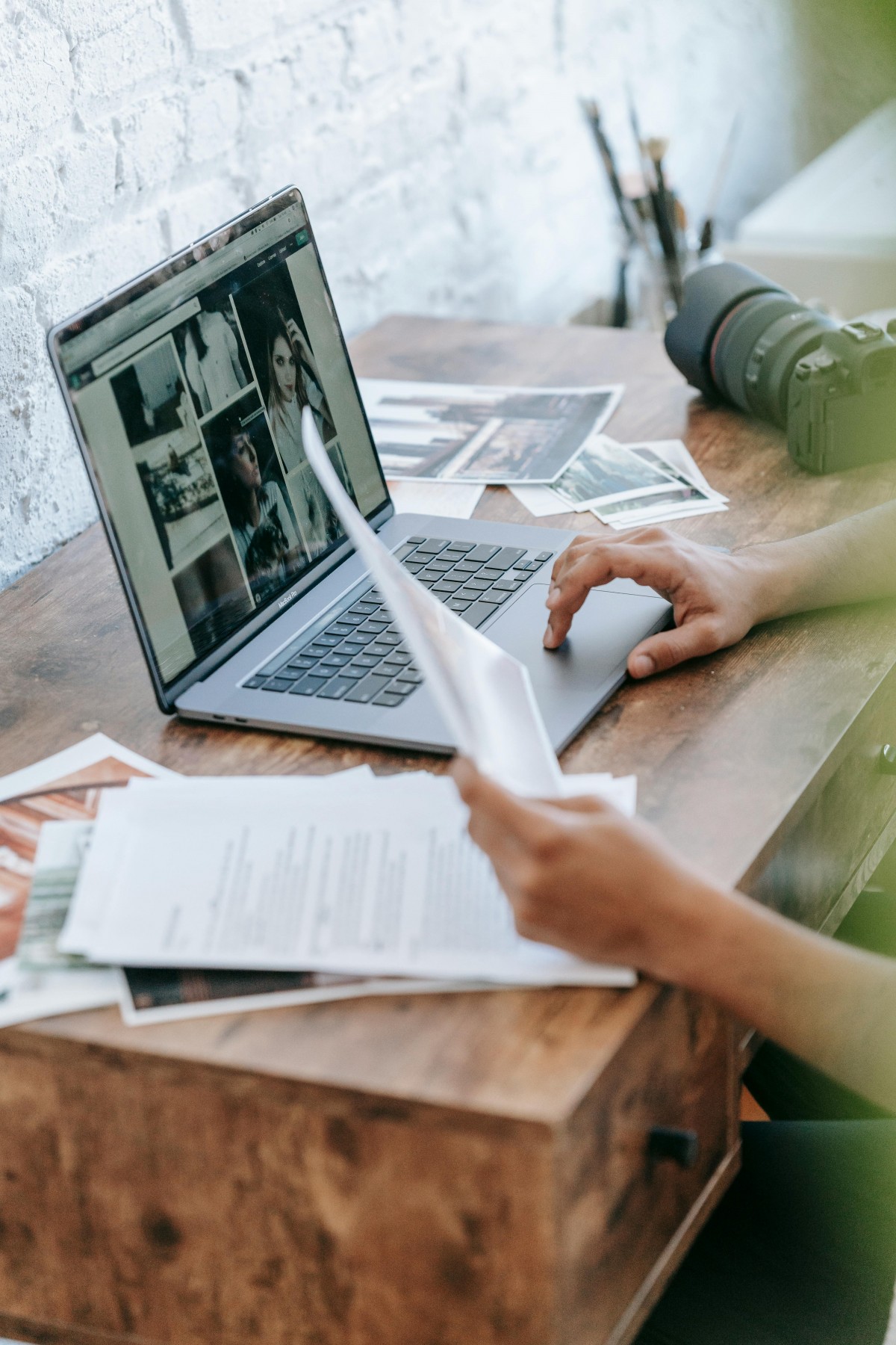 Laptop with person writing report