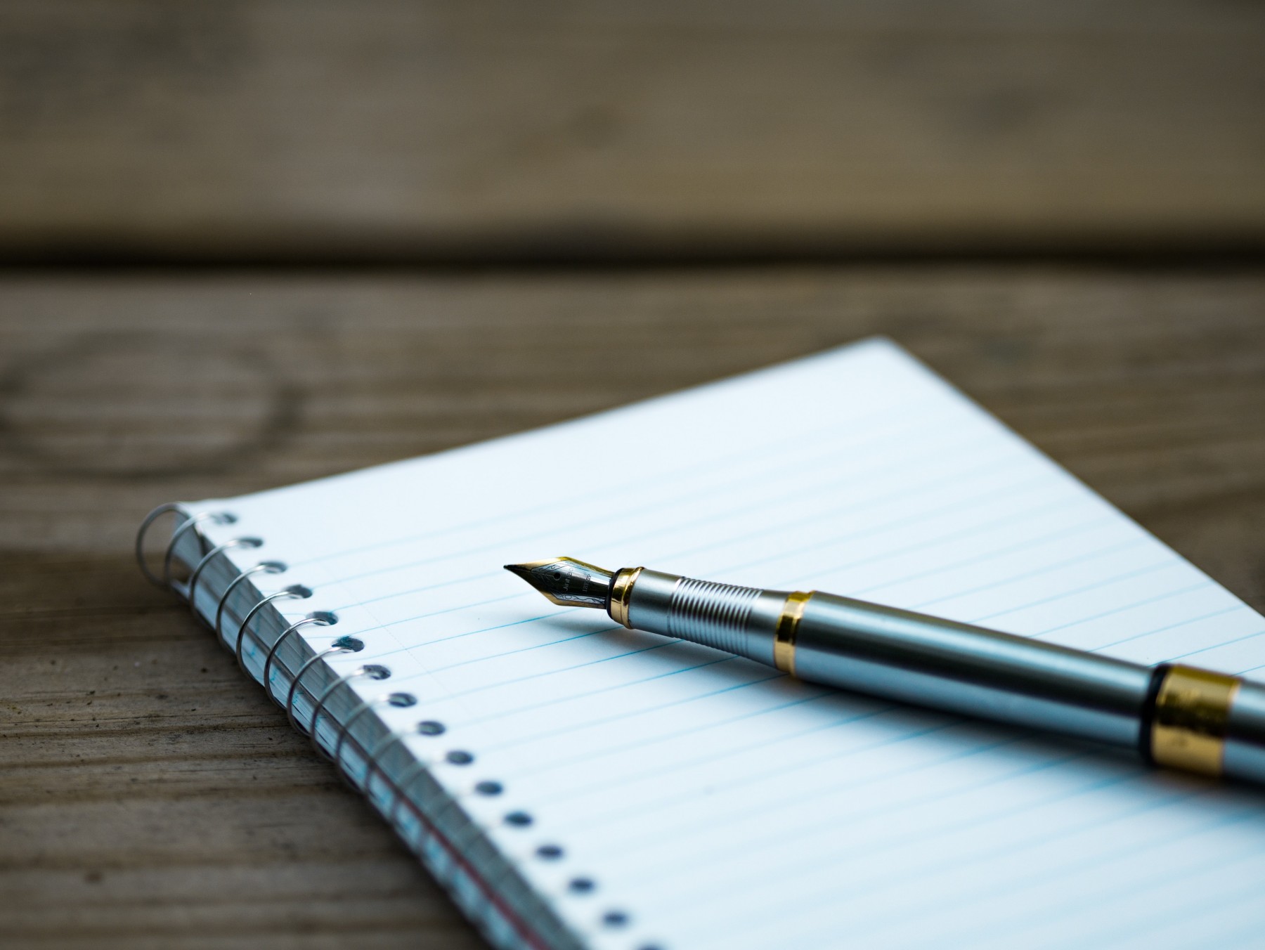 Writing persuasively with pen and notebook